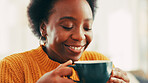Coffee, aroma and black woman on sofa in home with happiness, calm and relax on weekend. Smile, peace and African female person smelling scent of cappuccino, latte or matcha in living room at house.