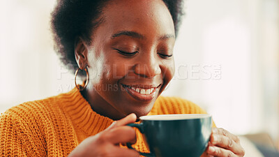 Buy stock photo Coffee, aroma and black woman on sofa in home with happiness, calm and relax on weekend. Smile, peace and African female person smelling scent of cappuccino, latte or matcha in living room at house.