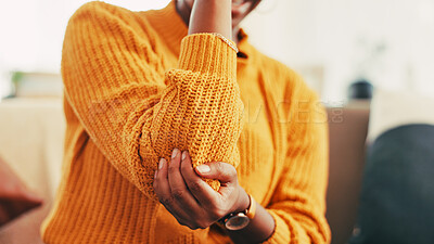 Buy stock photo Elbow, injury and pain for person, home and joint with inflammation in living room, cramp and hurt. Hands, accident and woman with muscle tension in house, healthcare and symptoms of arthritis