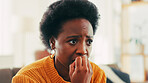 Anxiety, biting nails and black woman in home with stress, mental health and overwhelmed. Guilty, worry and African female person with fear for fail, mistake or abuse in living room at apartment.
