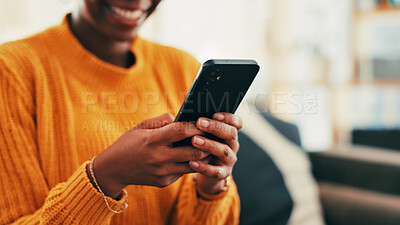 Buy stock photo Hands, smile and person with smartphone, texting and online dating with app in living room or relax. Home, typing and woman with mobile for communication, connection and happy for chat in lounge