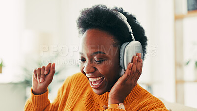 Buy stock photo Black woman, music and headphones in home for dance to audio, radio and hearing podcast on sofa. Happy african person relax for streaming sound, multimedia and online subscription in living room