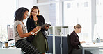 Writing, tablet and business women in office for online project, research and feedback for proposal. Professional, corporate and workers on digital tech for website review, teamwork and planning