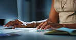 Person, hands and typing with research at night for email or communication at office desk. Closeup, journalist or reporter working late on computer for article, news deadline or publish at workplace