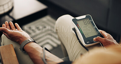 Buy stock photo Home, blood pressure and hands of man with machine for test, hypertension and check pulse on sofa. Healthcare, above and person with medical equipment for exam, monitor and measure heart rate