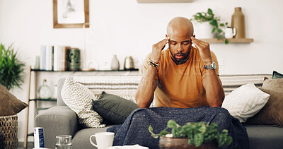Buy stock photo Home, tired and man with headache, stress and burnout with pain in living room. Person, apartment and guy on sofa with migraine, fatigue and exhausted with strain and pressure on temple from overwork