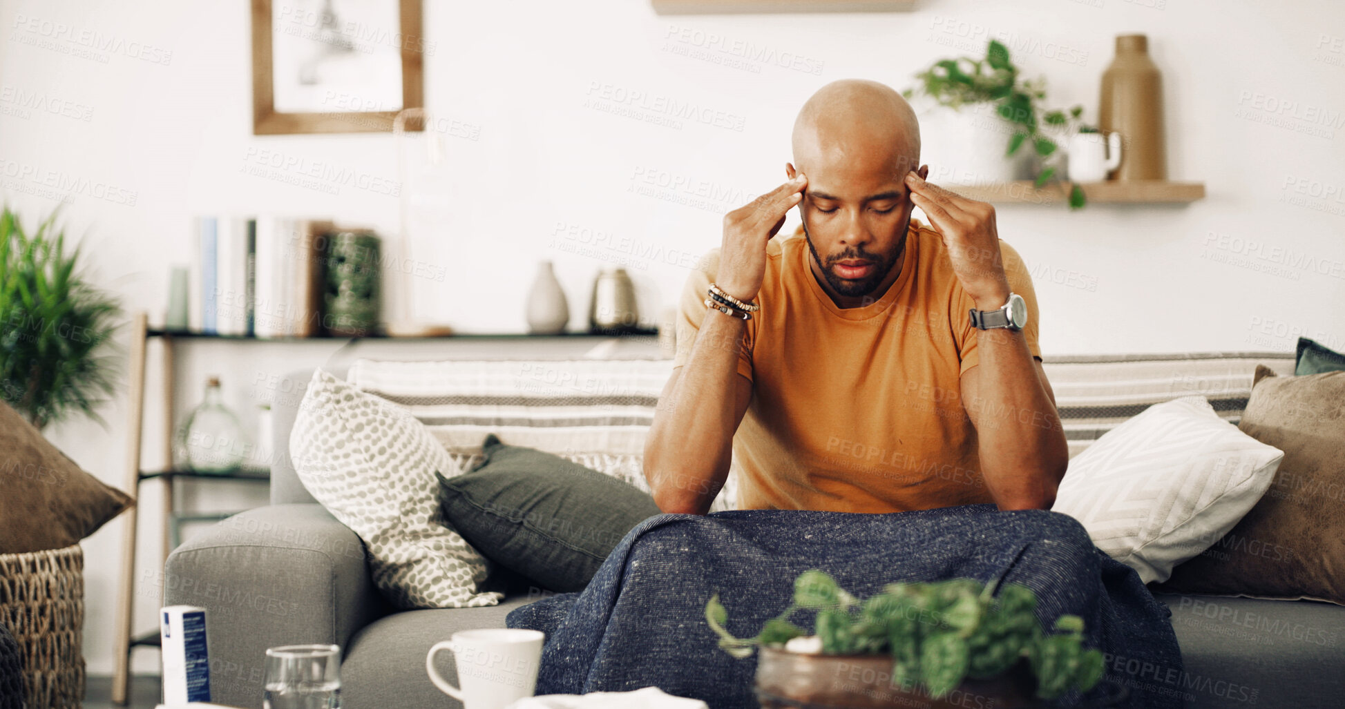 Buy stock photo Home, tired and man with headache, stress and burnout with pain in living room. Person, apartment and guy on sofa with migraine, fatigue and exhausted with strain and pressure on temple from overwork