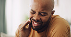 Toothache, pain and man in house with dental problem for cavity, gum disease or gingivitis. Inflammation, dentistry and male person with impacted wisdom teeth for tension, pressure or plaque in home.
