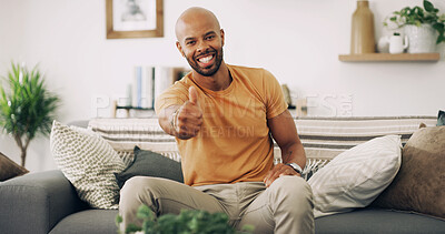 Buy stock photo Portrait, black man and relax with thumbs up at house for agreement, thank you and good news. Smile, male person and hand gesture for yes, voting support and feedback for announcement in living room
