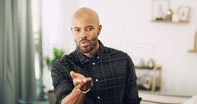 Buy stock photo Man, portrait and blow kiss in living room for love, flirty and date for valentines day. African person, pout gesture and expression in home for romance, care and show appreciation in relationship