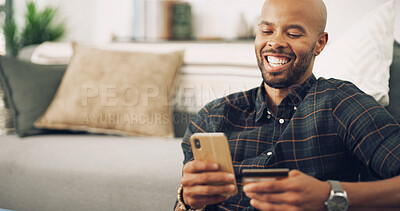 Buy stock photo Home, black man and mobile with credit card for payment, password information and online shopping. Laugh, male person and phone with debit for ecommerce, transaction and subscription for application