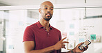 Planning, glass wall and man with phone, app development and ideas for agenda, brainstorming and business. Presentation, media analyst and pointing for project, person and audience research in agency