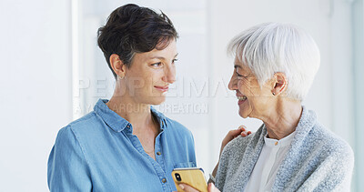 Buy stock photo Phone, helping and person with senior woman for mobile app, internet and assistance in home. Retirement, caregiver and mom and adult daughter on smartphone for communication, online and telehealth