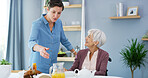 Senior, woman and caregiver with food in retirement for lunch meal, healthcare support and morning nutrition. Happy, assisted living and person with disability in home for helping hand and assistance