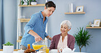 Senior, woman and caregiver with juice in retirement for lunch meal, healthy diet and morning nutrition. Support, assisted living and happy person in home for helping hand, serving breakfast and food