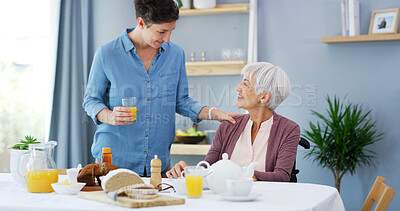 Buy stock photo Senior, woman and caregiver with food in home for breakfast meal, healthcare support and retirement service. Nutrition, assisted living and happy person with wheelchair for helping hand or assistance