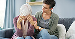 Comfort, sofa and woman with senior mother for grief, loss or emotions with care and empathy. Support, hug and female person helping elderly mom with sadness, memory or alzheimers in retirement home.