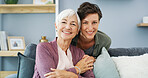 Hugging, portrait and woman with senior mom on sofa for bonding, connection and family time. Happy, love and female person embrace elderly mother with care in living room for visit at retirement home