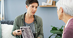 Doctor, patient and consultation with tablet for brain scan, cancer diagnosis with CT results and healthcare. Explain MRI, treatment plan and surgeon with senior woman for neurology update on screen