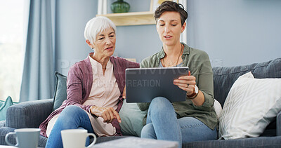 Buy stock photo Tablet, teaching and woman with senior mother on sofa for chatting, scrolling or networking. Digital technology, learning and female person helping elderly mom with online communication in home.