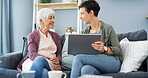 Tablet, teaching and woman with senior mom on sofa for chatting, scrolling or networking. Digital technology, learning and female person helping elderly mother with online communication in home.