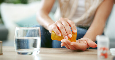 Buy stock photo Person, hands and pills with water for medication, prescription or chronic illness at home. Closeup, patient or disease with container, pharmaceuticals or drugs for medical symptoms or health at house