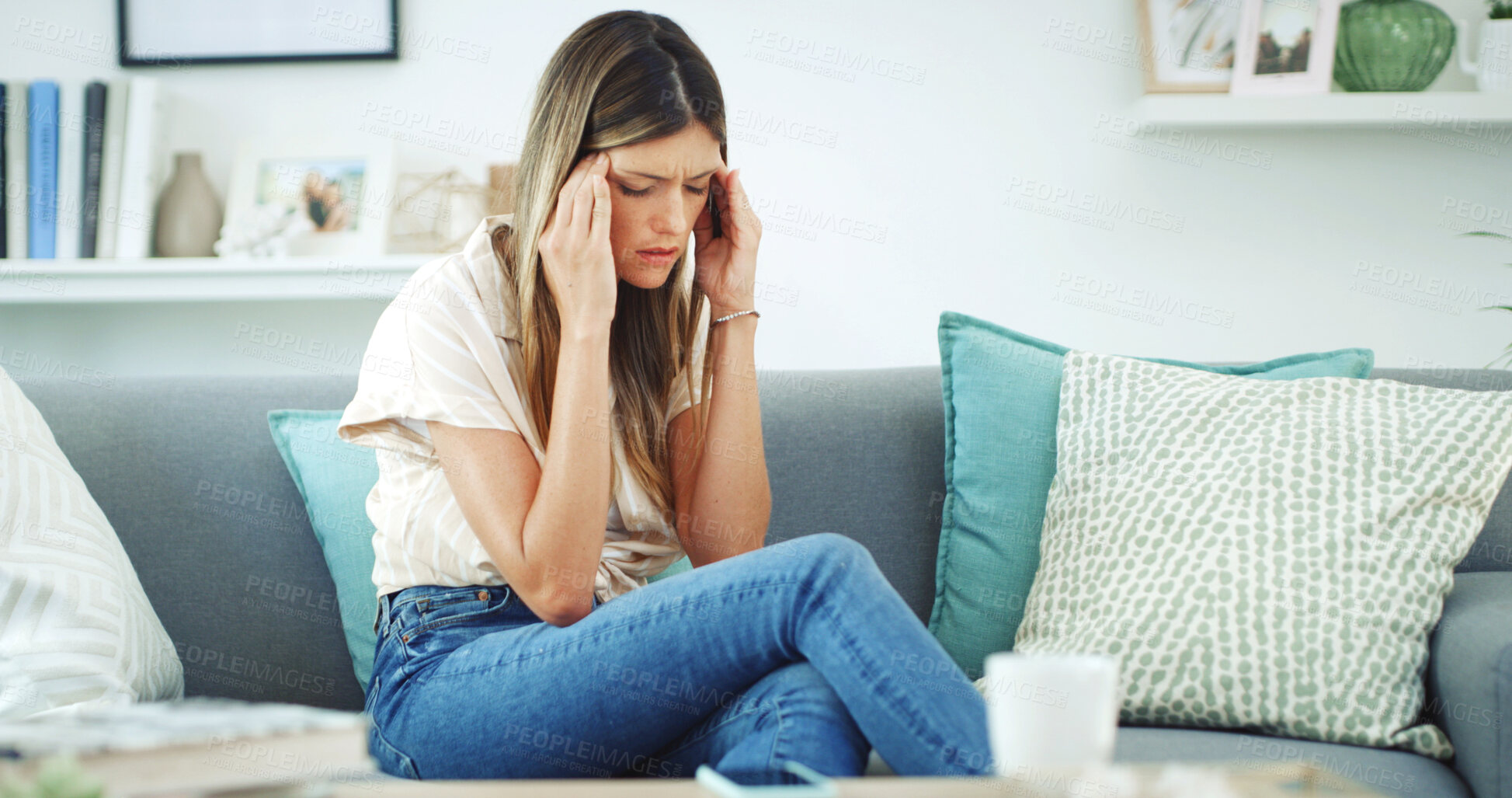 Buy stock photo Woman, sofa and stressed with headache, migraine or anxiety with massaging temple in living room. Tension, mental health and wellness discomfort, crisis and worried female person frustrated in lounge