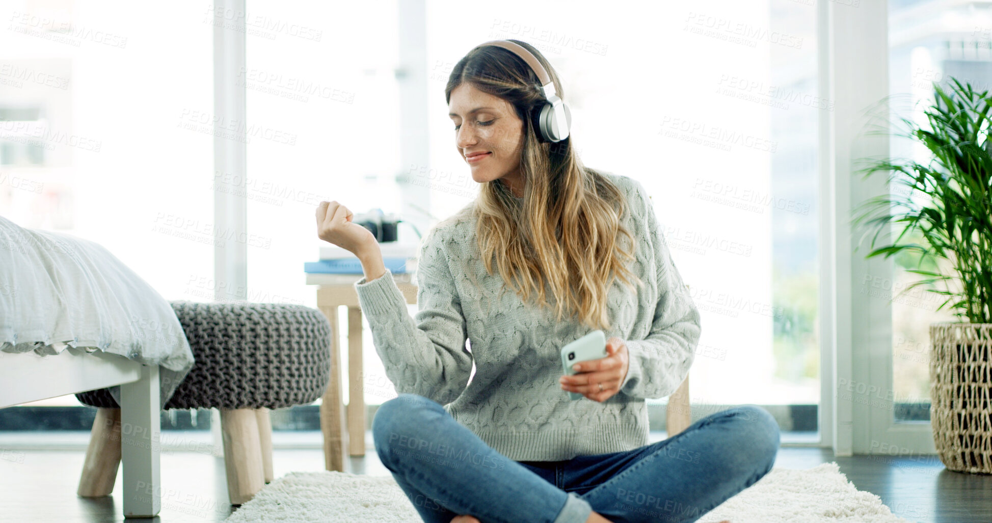 Buy stock photo Smartphone, dancing and woman with headphones, home and listening to music with app or entertainment. Break, streaming and person with tech for radio, sound and mobile with playlist for girl in house
