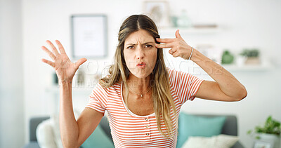 Buy stock photo Angry, finger gun and portrait of woman in home living room for disappointment, frustration or problem. Annoyed, cross and frown of unhappy person in apartment for conflict, emotions or stress