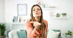Portrait, woman and blowing kiss in home for support, kindness and greeting gesture with care. Living room, person and romantic emoji for flirting, confidence and sign for love and affection in house