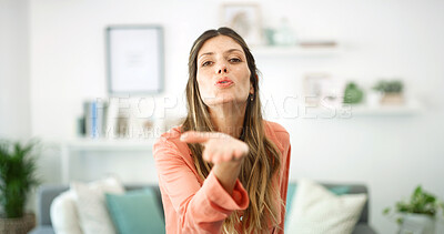 Buy stock photo Portrait, woman and blowing kiss in home for support, kindness and greeting gesture with care. Living room, person and romantic emoji for flirting, confidence and sign for love and affection in house