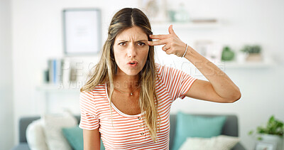 Buy stock photo Annoyed, finger gun and portrait of woman in home living room for disappointment, frustration or problem. Anger, cross and frown of unhappy person in apartment for conflict, emotions or stress