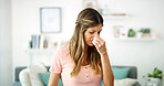 Woman, burnout and stressed with headache, migraine or anxiety with massaging temple in living room. Tension, mental health and wellness discomfort, crisis and worried female person frustrated