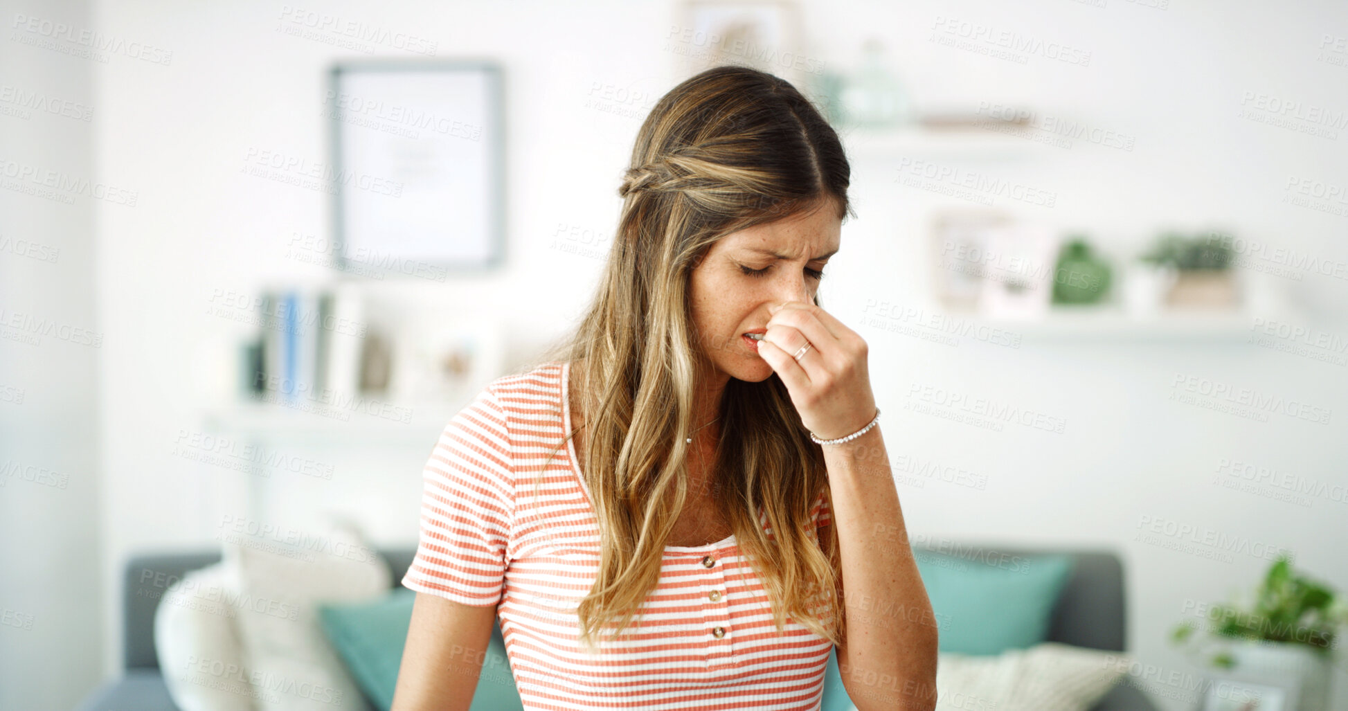Buy stock photo Bad smell, face and woman with nose pinch in living room for disgust, reaction and gas disapproval. Trash fragrance, frustrated and lady with expression for foul perfume, body odor or scent crisis