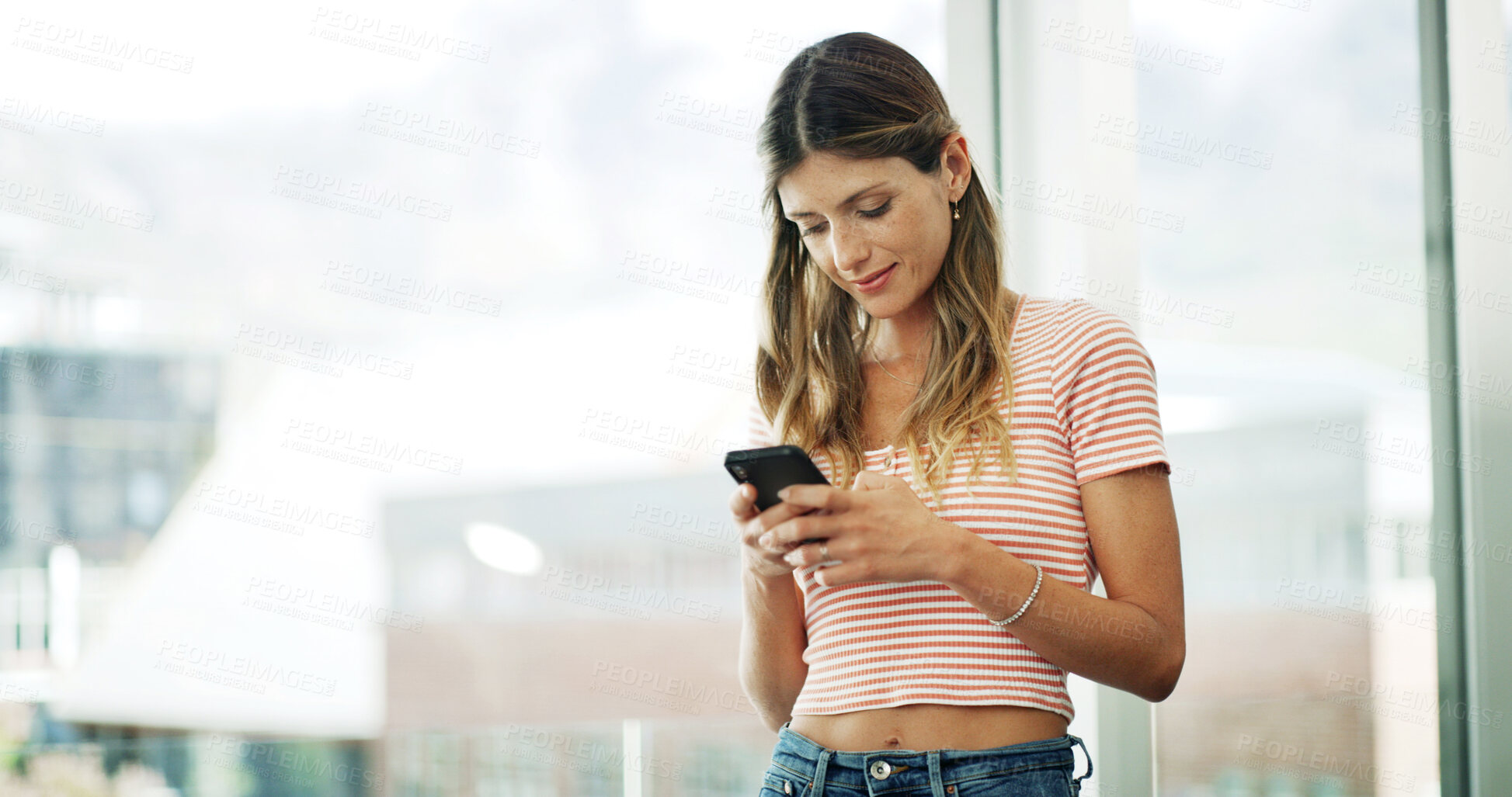 Buy stock photo Woman, phone and typing at window with relax, social media and message in texting app. Female person, mobile and online at home space for website, comment section and gossip conversation with contact