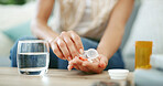 Person, hands and pills with water for prescription, kronic illness or medication at home. Closeup, patient or disease with container, pharmaceuticals or drugs for medical symptoms or health at house
