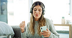 Smartphone, dancing and woman with headphones, fun and listening to music with app and entertainment. Break, streaming and person with tech for radio, sound and mobile with playlist for girl in house