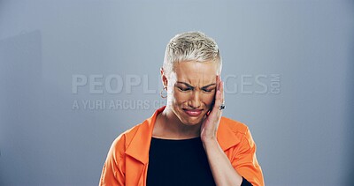 Buy stock photo Woman, grief and tears for crying in studio for mourning loss, broken heart and bad news. Person, mockup space and sad of depression sorrow, mental health and ptsd of trauma memory on gray background