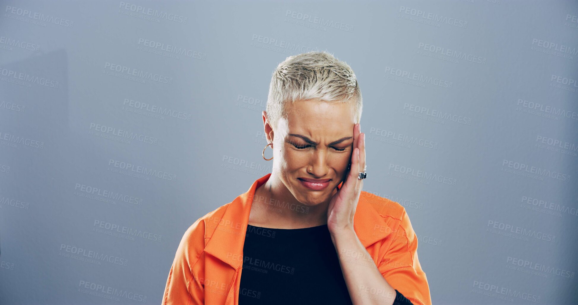 Buy stock photo Woman, grief and tears for crying in studio for mourning loss, broken heart and bad news. Person, mockup space and sad of depression sorrow, mental health and ptsd of trauma memory on gray background