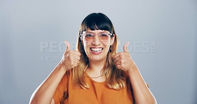 Buy stock photo Thumbs up, feedback and portrait of woman in studio with support, agreement or success emoji. Excited, face and female person from Mexico with approval or thank you hand gesture by gray background.