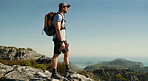 Hiking, fitness and thinking with man in nature for cliff, travel adventure and workout. Space, reflection and exercise with person outdoor view on mountain for trekking holiday, explore and peace