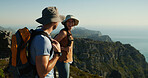 Happy couple, hiking or mountain view with blue sky for adventure, travel or sightseeing vacation. Man, woman or hikers with smile, hat or backpack for trekking challenge, journey or outdoor exercise