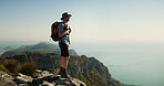 Hiking, travel and thinking with man in nature for fitness, mountain adventure and workout. Space, reflection and exercise with person outdoor view on cliff for trekking holiday, explore and peace