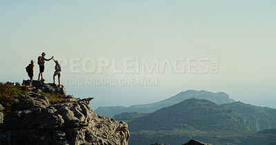 Buy stock photo Hiking, group and friends on mountain, high five and scenery in nature, space and adventure for tourists. Celebration, traveller and people with gesture for holiday, view and success for backpacker