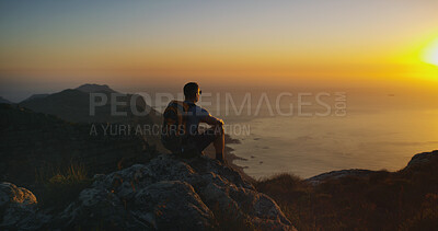 Buy stock photo Thinking, hiking and man with sunset, back and travel with weekend break, fitness and ocean. Person, outdoor and hiker with wellness, healthy and daydreaming with vacation, trekking and hobby