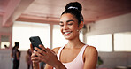 Fitness, woman and social media with smartphone in gym, health club and application for workout. Studio, female person and laugh with mobile for exercise video, meme and virtual tutorial for cardio