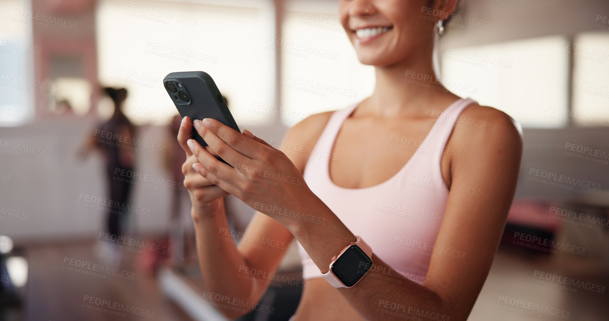 Buy stock photo Workout, woman and social media with mobile in gym, health club and application for fitness. Hands, happy person and below with phone for exercise video, connection and virtual tutorial for cardio