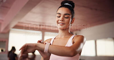 Buy stock photo Pilates, smile and watch with woman in studio, tracking performance progress of training routine. Exercise, fitness and time with happy athlete person in gym class for challenge, milestone or workout