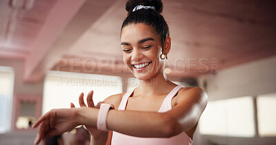 Buy stock photo Fitness, smart watch and woman in gym, health and check progress with exercise goals. Person, smile or athlete in wellness center, app for heart monitor or pride with results, workout or cardio stats