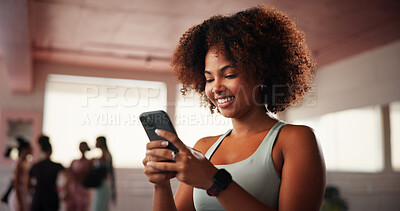 Buy stock photo Girl, phone and texting at gym with fitness, contact or excited with smile for stats with wellness. Woman, smartphone and app for progress, report and happy for results with workout at exercise club